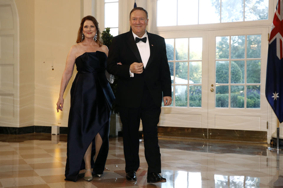 Secretary of State Mike Pompeo, right, and wife Susan Pompeo arrive for a State Dinner with Australian Prime Minister Scott Morrison and President Donald Trump at the White House, Friday, Sept. 20, 2019, in Washington. (AP Photo/Patrick Semansky)