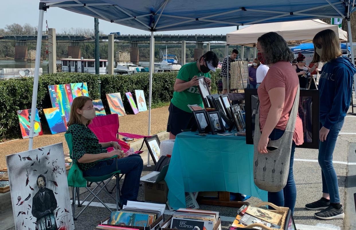 FILE - Residents can shop for various hand-crafted items at the 5th Street Marina's Holiday Market at the Marina on Sunday near the Riverwalk in Augusta.