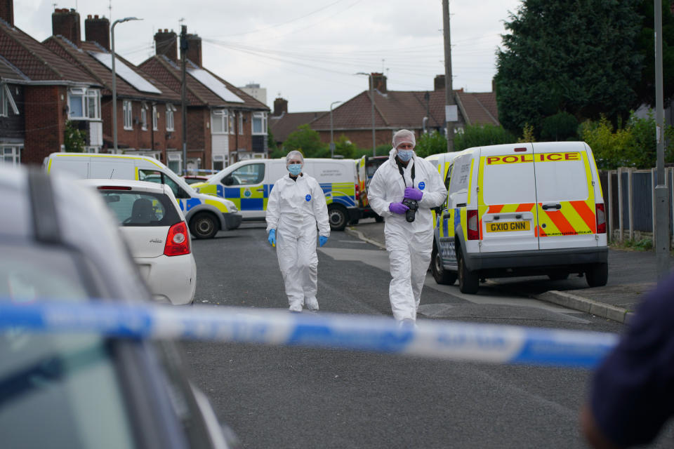 Forensic officers near to the scene in Kingsheath Avenue, Knotty Ash, Liverpool, where a nine-year-old girl has been fatally shot. Officers from Merseyside Police have started a murder investigation after attending a house at 10pm Monday following reports that an unknown male had fired a gun inside the property. Picture date: Tuesday August 23, 2022.