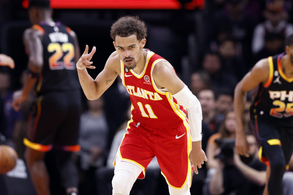 PHOENIX, ARIZONA - FEBRUARY 01: Trae Young #11 of the Atlanta Hawks gestures after hitting a three-point basket in the second half against the Phoenix Suns at Footprint Center on February 01, 2023 in Phoenix, Arizona. NOTE TO USER: User expressly acknowledges and agrees that,  by downloading and or using this photograph,  User is consenting to the terms and conditions of the Getty Images License Agreement.  (Photo by Chris Coduto/Getty Images)