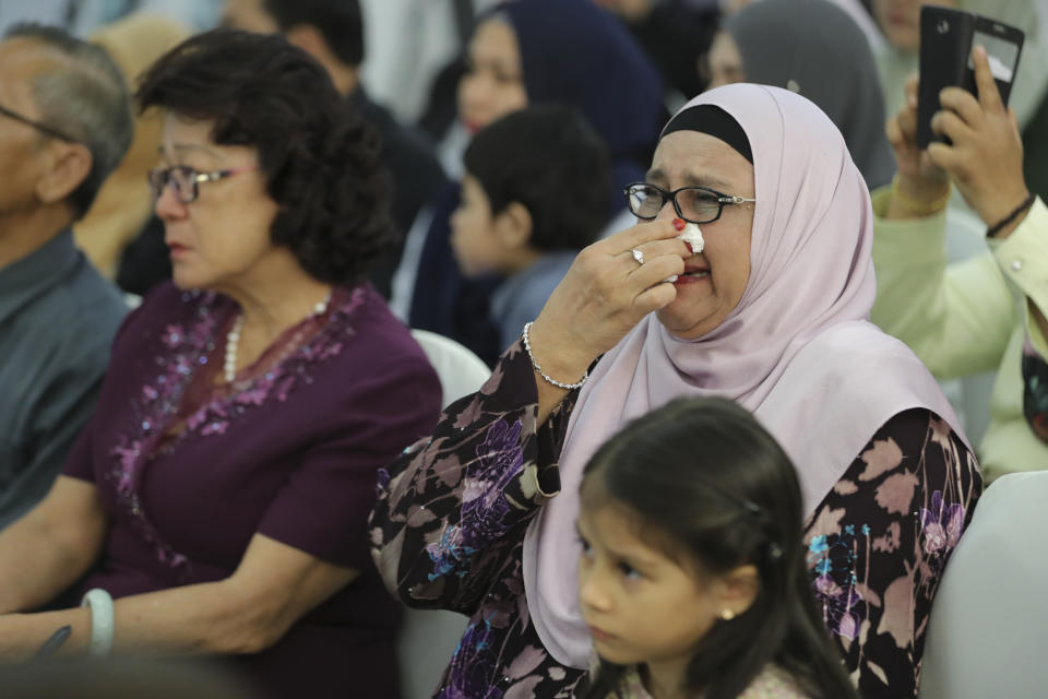 Friends and family of victims from Malaysia Airlines Flight MH17 plane crash attend a ceremony marking the fifth anniversary of the tragedy in Kuala Lumpur, Malaysia, Wednesday, July 17, 2019. Five years after a missile blew Malaysia Airlines Flight 17 out of the sky above eastern Ukraine, relatives and friends of those killed gathered Wednesday in Kuala Lumpur and at a Dutch memorial to mark the anniversary. (AP Photo/Vincent Thian)