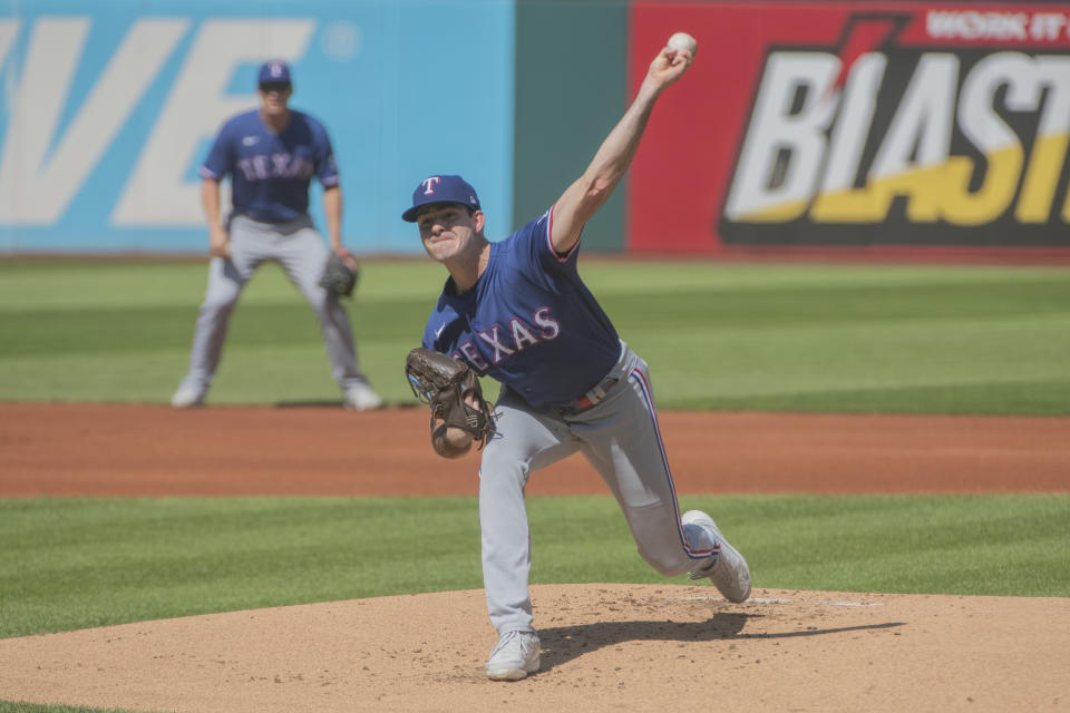 Texas Rangers starting pitcher Cody Bradford delivers against the Cleveland Guardians during the first inning of a baseball game in Cleveland, Sunday, Sept. 17, 2023. (AP Photo/Phil Long)