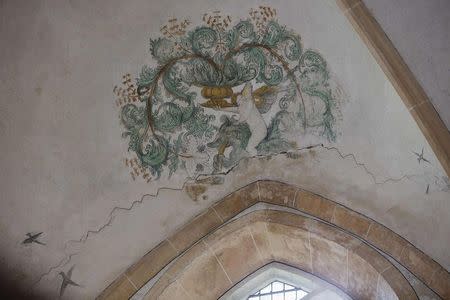 A view of a crack in a 13th-century church caused by an earthquake in Middelstum February 24, 2015. REUTERS/Michael Kooren