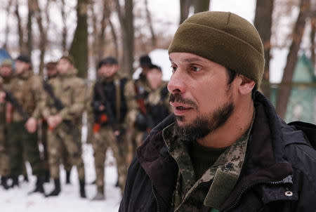 One of the pro-Russian separatist leaders from the Chechen "Death" battalion, identified as his nickname "Stinger", speaks during a training exercise in the territory controlled by the self-proclaimed Donetsk People's Republic, eastern Ukraine, December 8, 2014. REUTERS/Maxim Shemetov