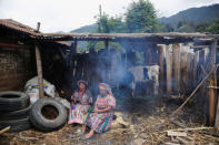 Women sit outside the house of the family of Claudia Gomez, a 19-year old Guatemalan immigrant who was shot by an U.S. Border Patrol officer, in San Juan Ostuncalco, Guatemala May 27, 2018. REUTERS/Luis Echeverria