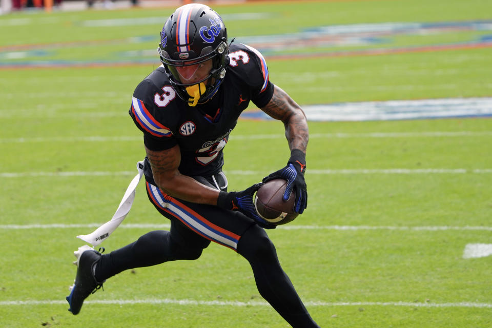 Florida wide receiver Eugene Wilson III (3) makes a reception for a 6-yard touchdown against Arkansas during the first half of an NCAA college football game, Saturday, Nov. 4, 2023, in Gainesville, Fla. (AP Photo/John Raoux)