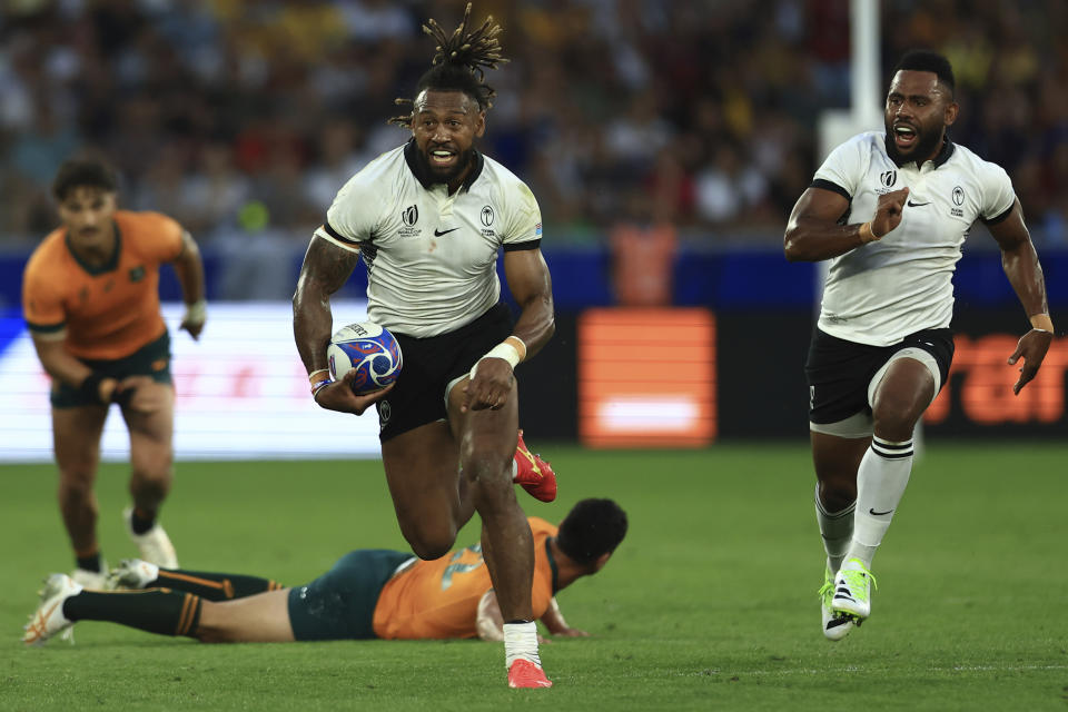 Fiji's Waisea Nayacalevu runs with the ball during the Rugby World Cup Pool C match between Australia and Fiji at the Stade Geoffroy Guichard in Saint-Etienne, France, Sunday, Sept. 17, 2023. (AP Photo/Aurelien Morissard)