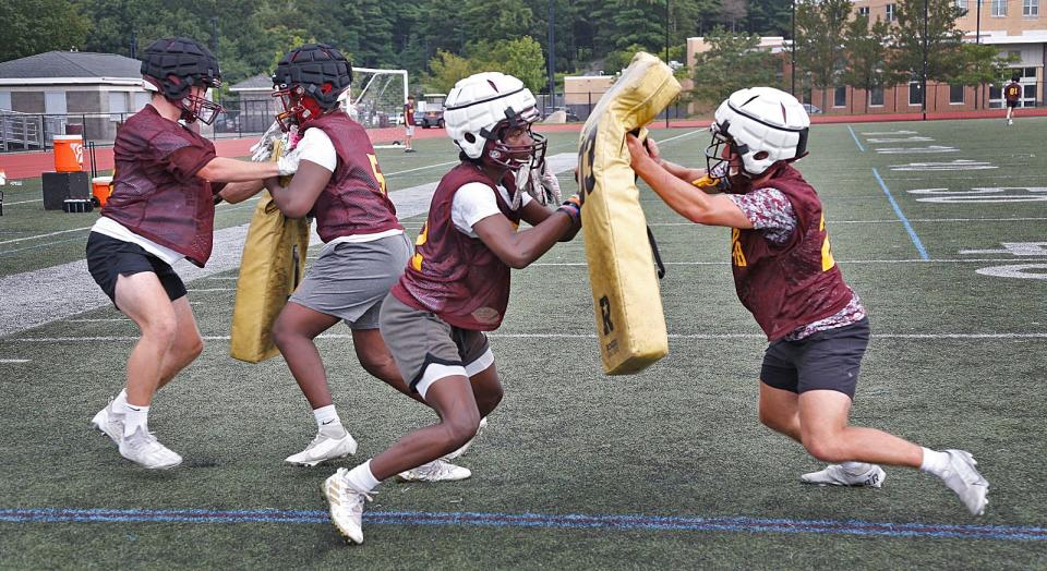 Weymouth High offensive and defensive lineman battle with the blocking dummies on Monday, Aug. 21, 2023.