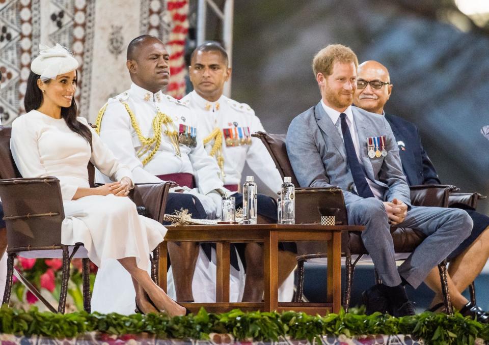 <p>Harry and Meghan take their seats for the official welcome ceremony.</p>