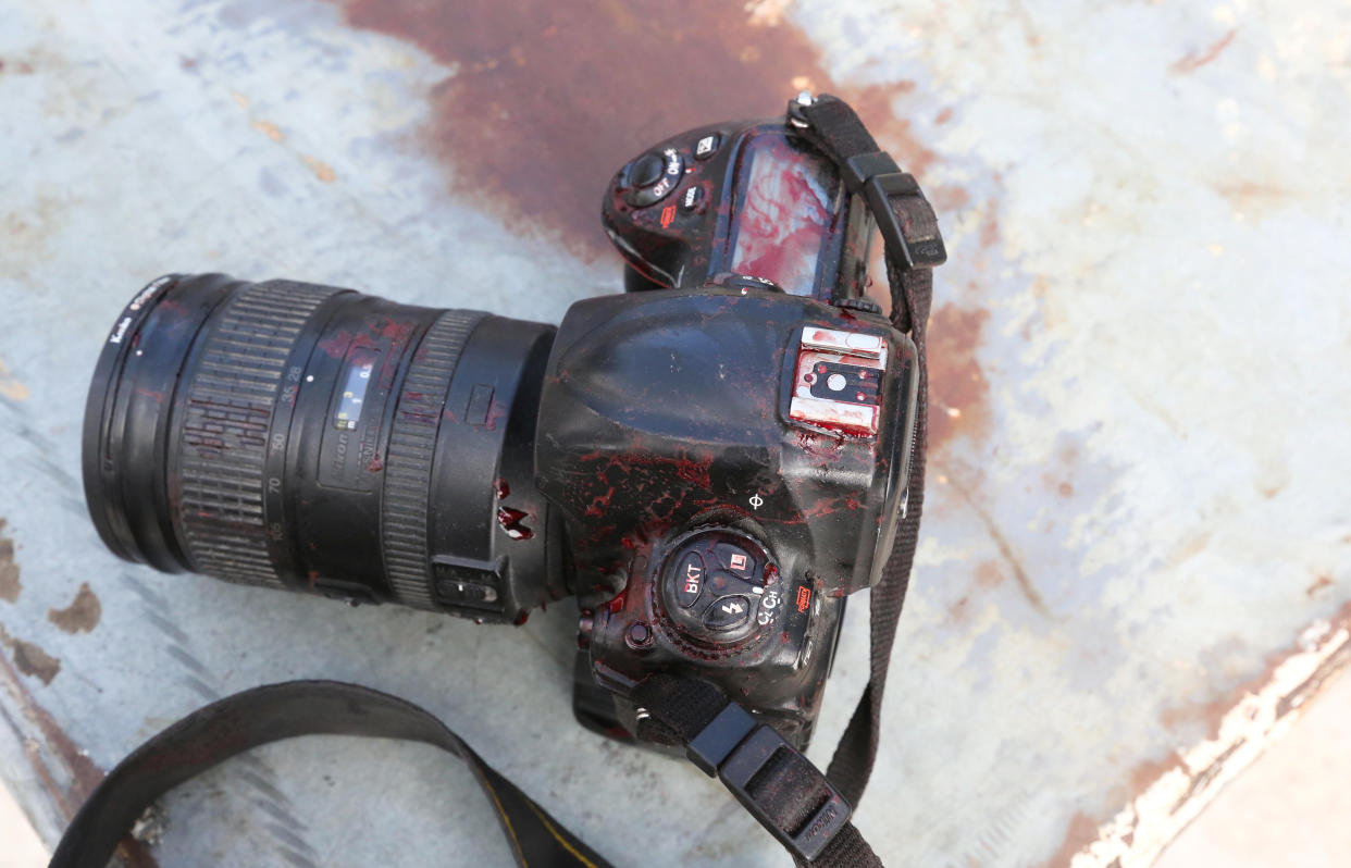 The blood stained camera of a photojournalist is seen in front of Dayah hotel in Somalia's capital Mogadishu, on Jan. 25. (Photo: Feisal Omar/Reuters)