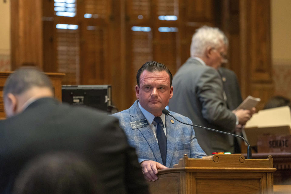 Georgia state Sen. Clint Dixon, R-Gwinnett, listens to a question during a debate on a substitute of House Bill 1104, a measure that originally dealt with suicide prevention, but was radically overhauled in Senate committee by adding a number of other bills that had earlier failed to pass the Senate, Tuesday, March 26, 2024, in Atlanta. (Matthew Pearson/WABE via AP)