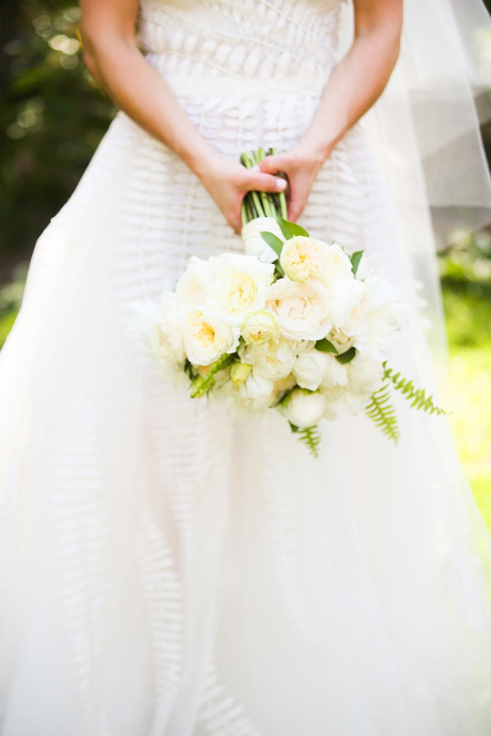 The bride wore Oscar de la Renta, inspired by her grandmother, for her greenery-filled ceremony at the Beverly Hills Hotel.