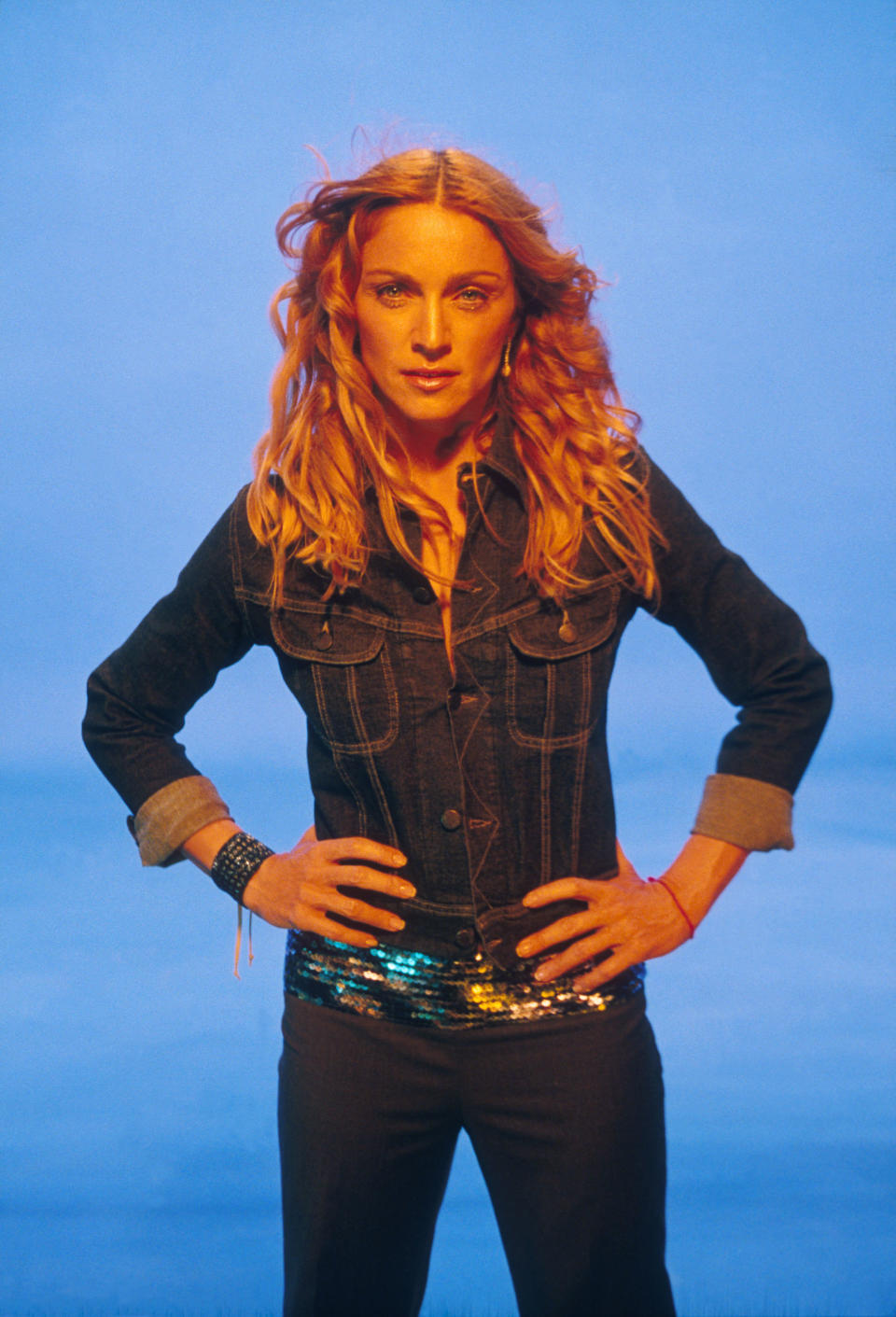 Madonna wore this iconic denim jacket ensemble for her &ldquo;Ray of Light&rdquo; music video in 1998. The outfit was one of the more pared down during this period, which marked yet another reinvention for the singer that was quite different from any of her previous phases. As Dazed described it, the album, also called &ldquo;Ray of Light,&rdquo; feels &ldquo;<a href="http://www.dazeddigital.com/music/article/39140/1/madonna-ray-of-light-20-anniversary" target="_blank" rel="noopener noreferrer">spiritual, elemental, and enlightened</a>.&rdquo; Around this time, she embraced Kabbala. (On her wrist, you can spot the red string bracelet associated with the religion.)
