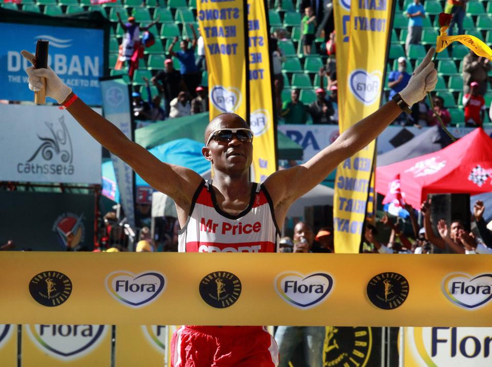 A runner reaching the finish line.