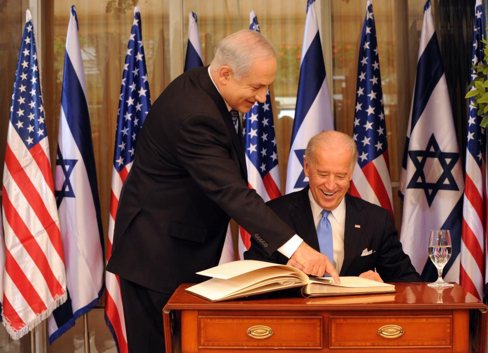 JERUSALEM, ISRAEL - MARCH 09:  L - R Israeli Prime Minister Benjamin Netanyahu helps US Vice President Joe Biden as he signs the guestbook at the Prime Minister's residence on March 9, 2010 in Jerusalem, Israel. The American Vice-President is in the Middel East to meet Israeli leaders including Peres and Israeli Prime Minister Benjamin Netanyahu before travelling to Jordan on Thursday.