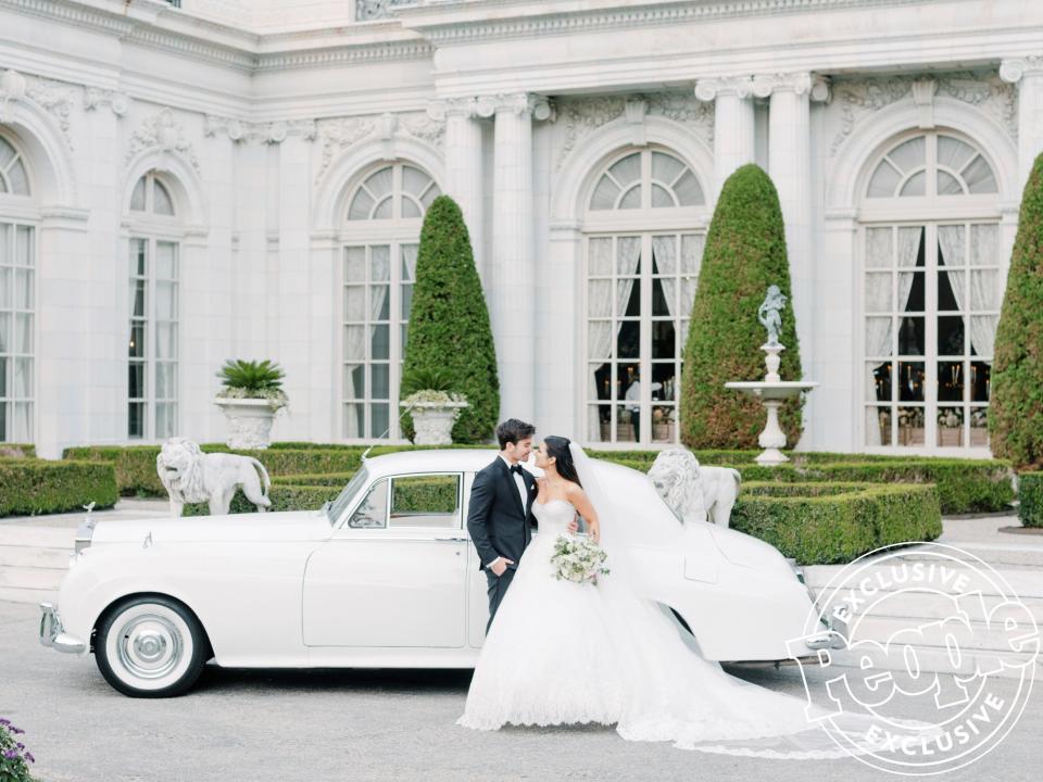 After the ceremony, the couple jumped into a 1957 Rolls-Royce Silver Cloud <a href="https://www.fivestarlimo.com/" rel="nofollow noopener" target="_blank" data-ylk="slk:from Five Star Limo;elm:context_link;itc:0;sec:content-canvas" class="link ">from Five Star Limo</a> to travel to their reception.