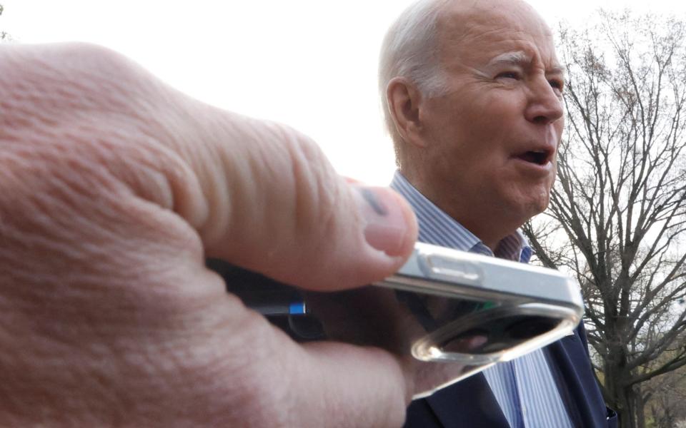 Joe Biden tells a reporter it's 'not the plan right now' to expel Russian journalists - JONATHAN ERNST/REUTERS