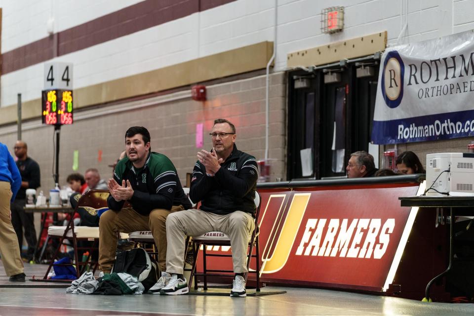 Ridge head wrestling coach Roy Dragon III (left) and his father and assistant Roy Dragon at the 2024 Region 4 tournament at Union High School