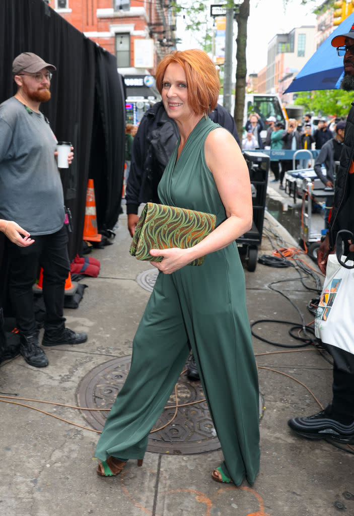 Cynthia Nixon is seen filming on the set of "And Just Like That, green jumpsuit, Cast on the set of And Just Like That... Season 3 filming, costumes, fashion, outfits