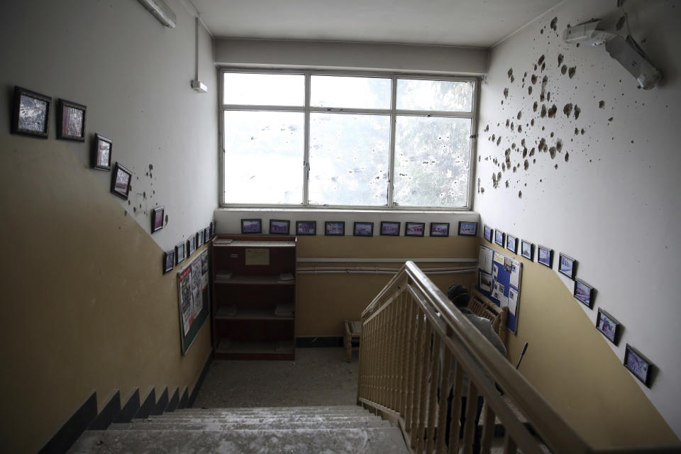 A bullet holes line the wall of a maternity hospital, in Kabul, Afghanistan, Tuesday, May 12, 2020. Gunmen stormed the hospital in the western part of Kabul on Tuesday, setting off a shootout with the police and killing several people. (AP Photo/Rahmat Gul)