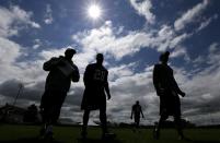 Minnesota Vikings running back Adrian Peterson, second from left, walks off the field following an NFL football training camp practice, Sunday, July 27, 2014, in Mankato, Minn. (AP Photo/Charlie Neibergall)