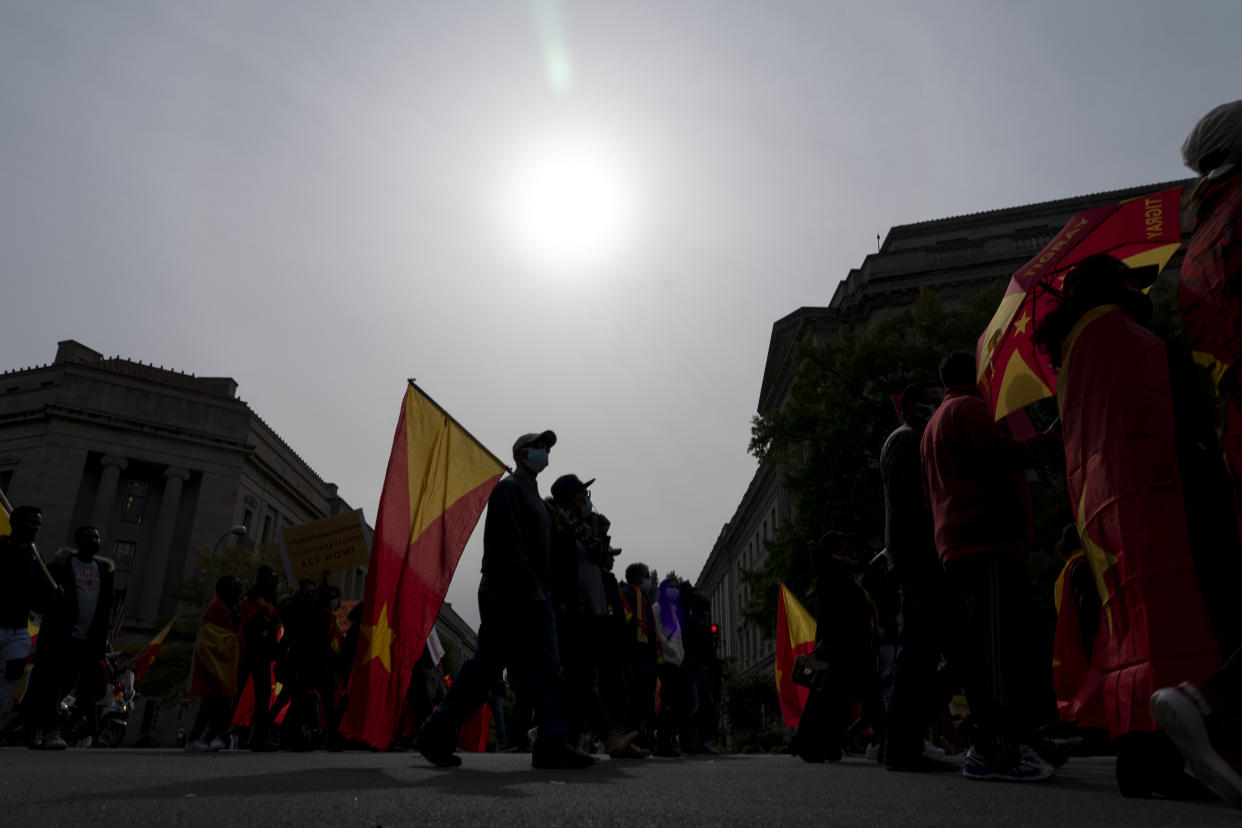 Exile Tigray community and their supporters march to mark a year since Ethiopia Prime Minister Abiy Ahmed's administration started fighting against the Tigray, the northernmost region in Ethiopia, at the U.S. Capitol, Thursday, Nov. 4, 2021, in Washington. (AP Photo/Gemunu Amarasinghe)