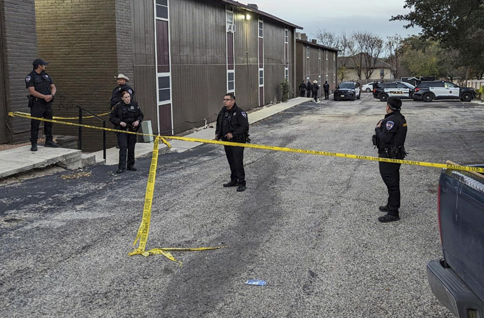 FILE - Police rope off the scene where two dead bodies were discovered, Dec. 26, 2023, in San Antonio, Texas. San Antonio police on Wednesday, Jan. 10, 2024, arrested a third person in connection to the killings of an 18-year-old pregnant Texas woman and her boyfriend, who were reported missing before Christmas and found fatally shot days later in a parking lot. (Jacob Beltran/The San Antonio Express-News via AP, File)