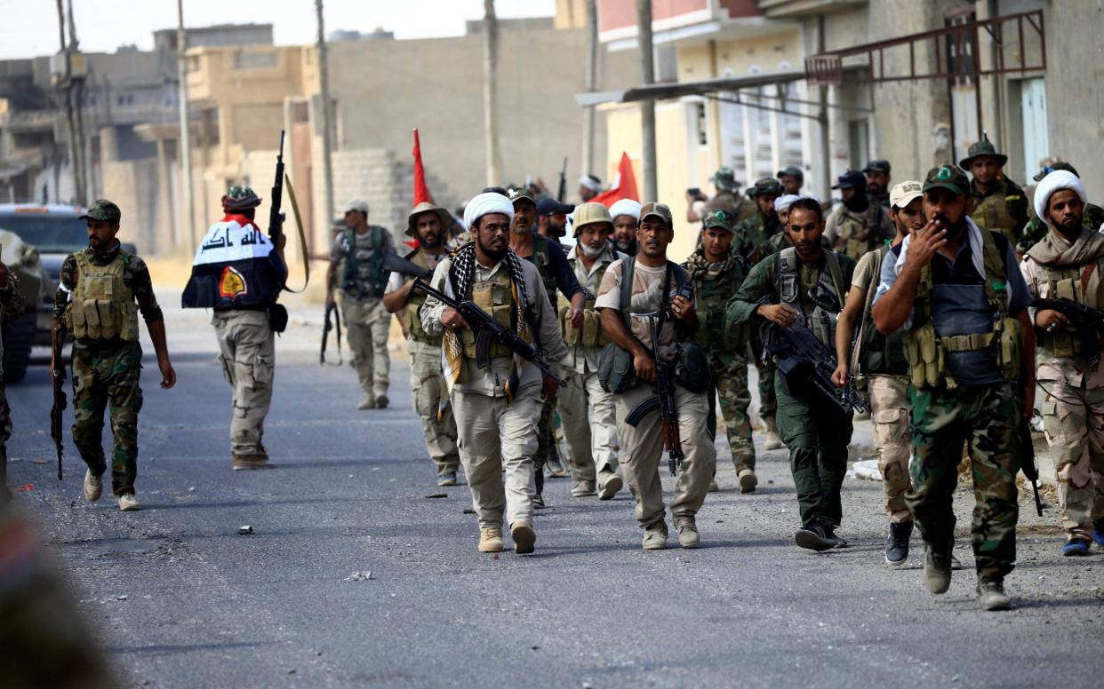 Iraqi troops and Shia militias marched into the heart of Tal Afar - REUTERS