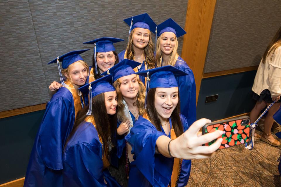 Isabel Read takes a selfie with her friends at the Kennebunk High School Class of 2023 graduation.
