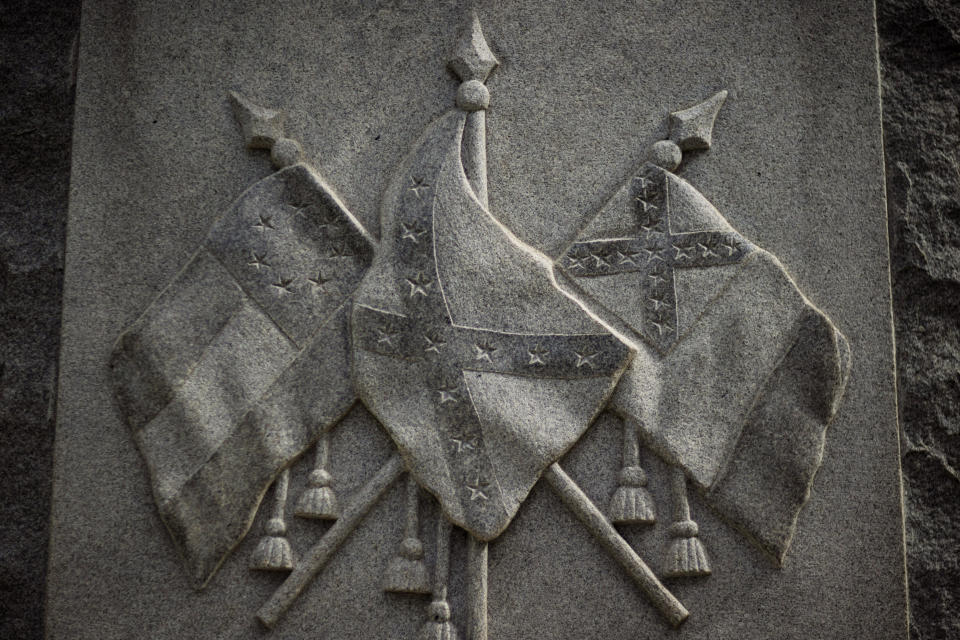 FILE - A Confederate monument stands outside the Putnam County Courthouse in Palatka, Fla., Thursday, April 15, 2021. According to public documents and interviews with a dozen inmates and current and former employees in the nation’s tenth largest prison system, Florida prison guards openly tout associations with white supremacist groups to intimidate inmates and Black colleagues, a persistent practice that goes unpunished and is allowed to fester in prisons throughout the U.S. (AP Photo/David Goldman, File)