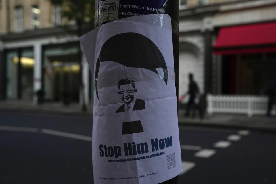 A placard featuring Chinese President Xi Jinping, is displayed near the Chinese embassy in London, Monday Nov. 28, 2022. Demonstrators gathered outside the Chinese embassy in London on Sunday night, in solidarity over unrest in China. Barely a month after granting himself new powers as China’s potential leader for life, Xi Jinping is facing a wave of public anger of the kind not seen for decades, sparked by his “zero COVID” strategy that will soon enter its fourth year. (AP Photo/Kin Cheung)