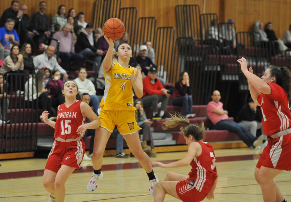 Weymouth's Larissa Gilberto, center, shoots over Hingham defenders from left, Colette Hanney, Caroline Connolly and Sarah Holler during girls basketball action at Weymouth High School, Monday, Feb. 20, 2023.