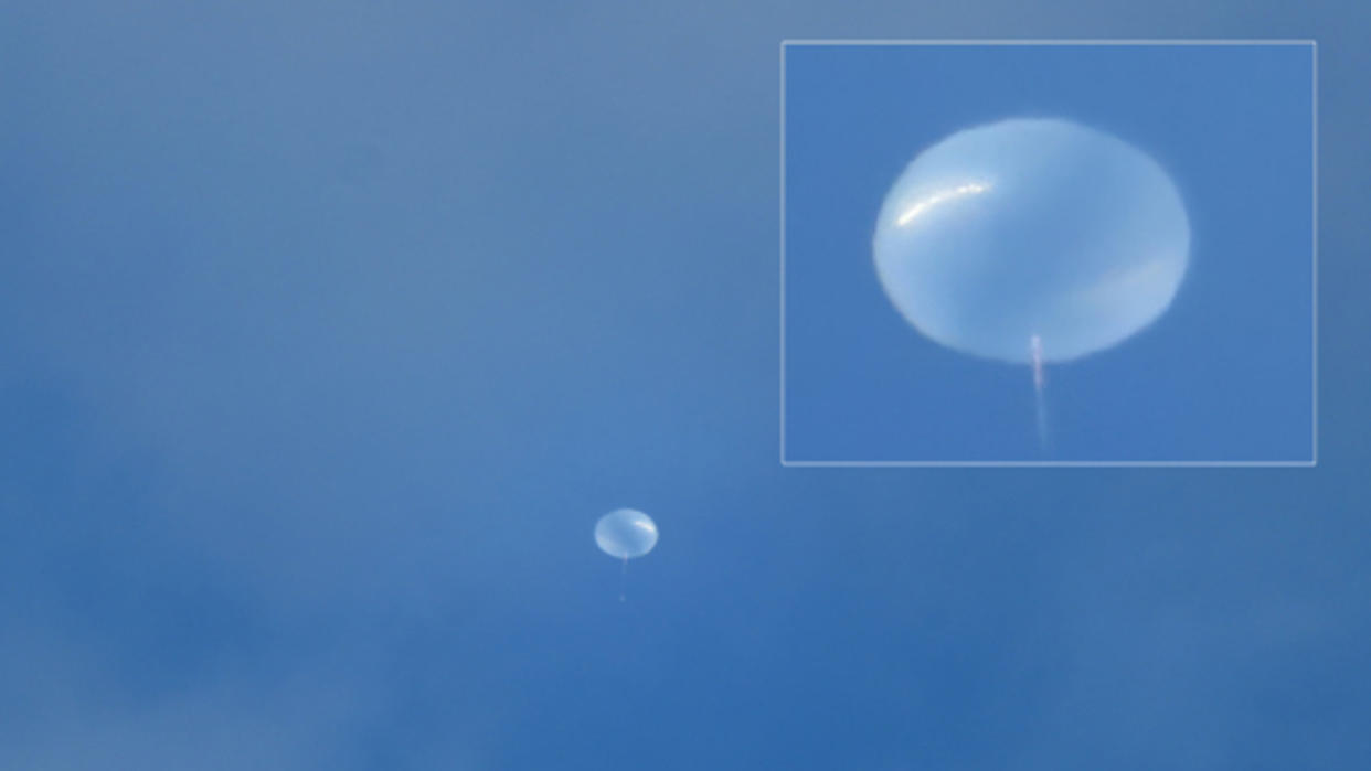  A white balloon against a blue sky 