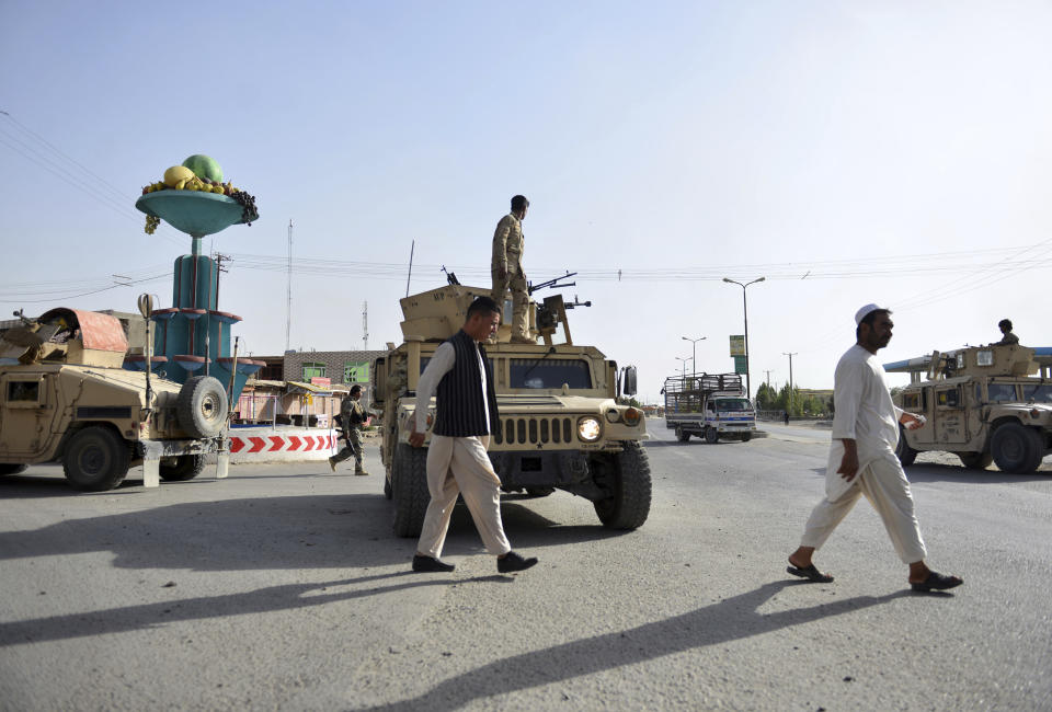 In this Sunday, Aug. 12, 2018, photo, Afghan Security personnel petrol in the city of Ghazni province, west of Kabul, Afghanistan. The United States has sent military advisers to aid Afghan forces in Ghazni, where they were struggling on Sunday to regain full control three days after the Taliban launched a massive assault on the eastern city. (AP Photo/Mohammad Anwar Danishyar)
