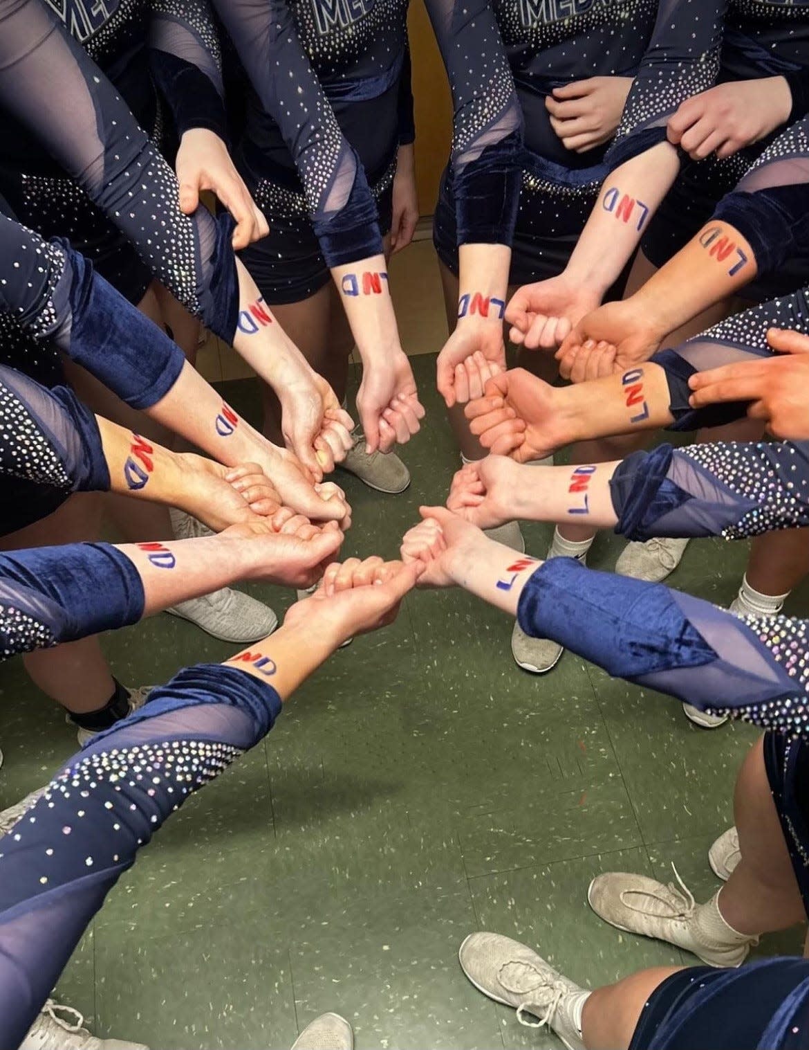The Medway High cheerleading team wrote "LND" on their arms, which stands for "Leave No Doubt" and became the team's motto for the postseason.