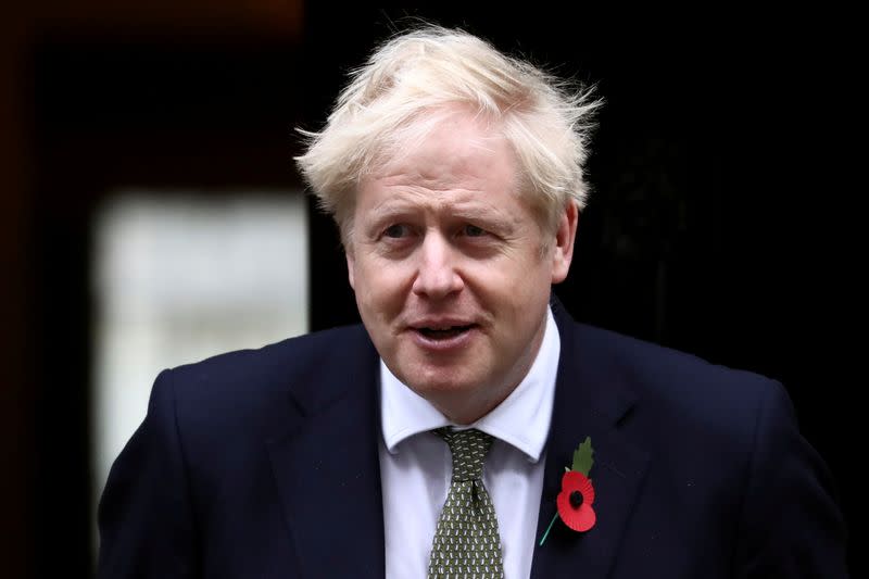 Britain's Prime Minister Boris Johnson meets fundraisers for the Royal British Legion outside Downing Street in London