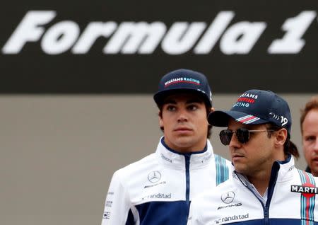 Formula One F1 - Japanese Grand Prix 2017 - Suzuka Circuit, Japan - October 5, 2017. Williams' Felipe Massa and Lance Stroll attend a fan event. REUTERS/Toru Hanai/File Photo