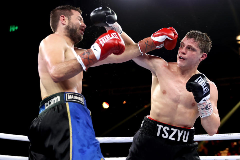 Nikita Tszyu (pictured right) and Ben Horn (pictured left) punch each other.