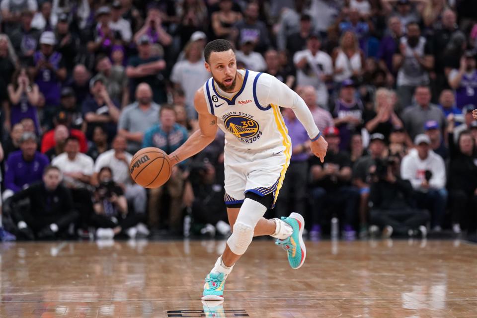 Golden State Warriors guard Stephen Curry dribbles the ball against the Sacramento Kings during their first-round playoff series.