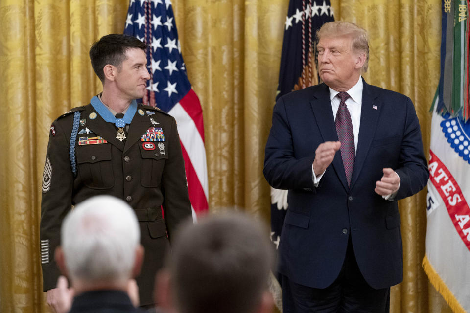 President Donald Trump awards the Medal of Honor to Army Sgt. Maj. Thomas P. Payne in the East Room of the White House, Friday, Sept. 11, 2020, in Washington. (AP Photo/Andrew Harnik)