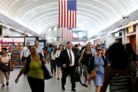 Commuters walk through New York's Pennsylvania Station which began track repairs causing massive disruptions to commuters in New York City, U.S., July 10, 2017. REUTERS/Brendan McDermid
