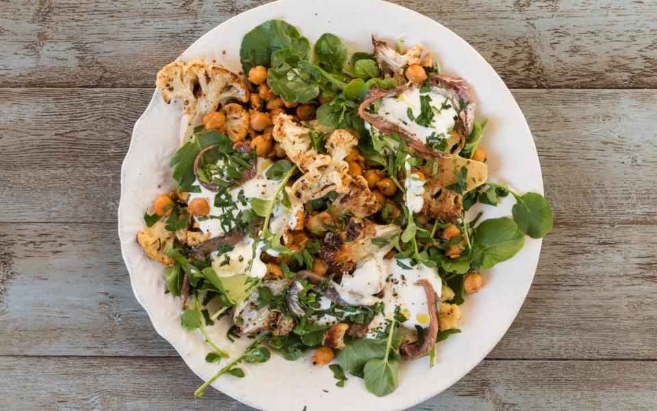 Roasted cauliflower with chickpeas, garlic, yogurt and anchovies - Credit: Andrew Crowley