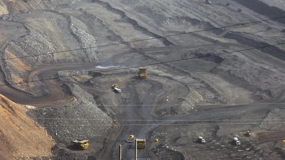 Machines working in huge quarry,Pingshuo coal mining site,China - stock photo