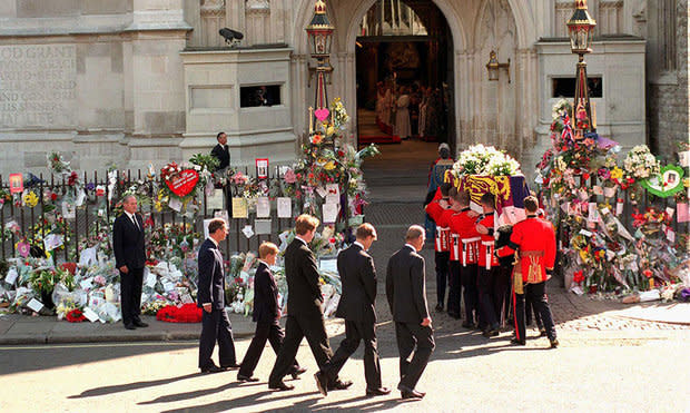 Diana's family walking behind her coffin