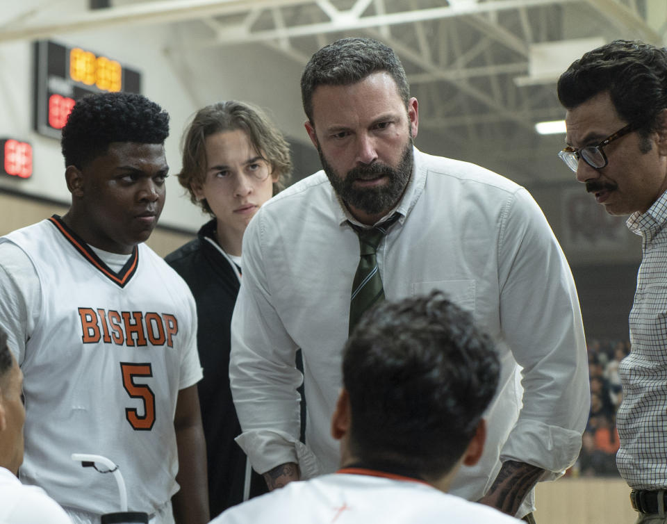 This image released by Warner Bros. Pictures shows Charles Lott Jr., left, Ben Affleck and Al Madrigal in a scene from "The Way Back." (Richard Foreman/Warner Bros. Pictures via AP)