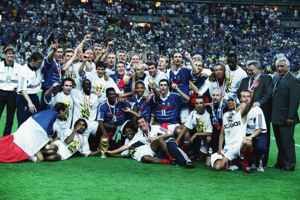 France's national football team celebrates on the pitch after winning the 1998 FIFA World Cup.