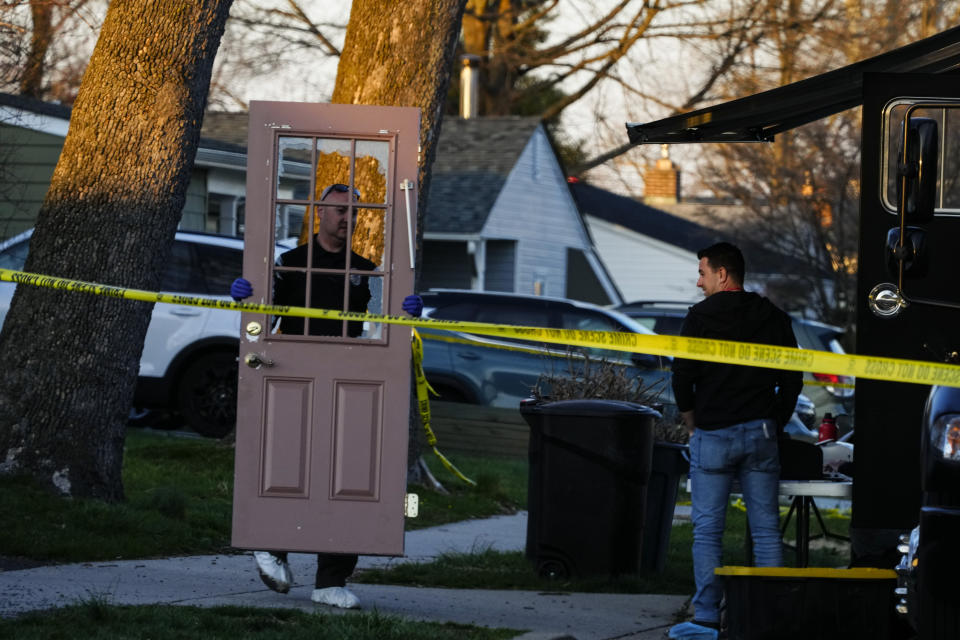 An investigator collects evidence from the scene of a fatal shooting in Levittown, Pa., Saturday, March 16, 2024. Police say a man suspected of killing multiple family members in the Philadelphia area has been arrested in New Jersey. (AP Photo/Matt Rourke)