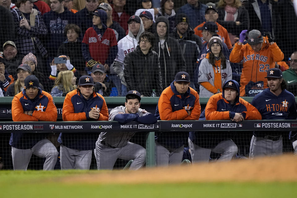 Members of the Houston Astros react after their loss against the Boston Red Sox in Game 3 of baseball's American League Championship Series Monday, Oct. 18, 2021, in Boston. The Red Sox won 12-3, to take a 2-1 game lead in the series. (AP Photo/David J. Phillip)