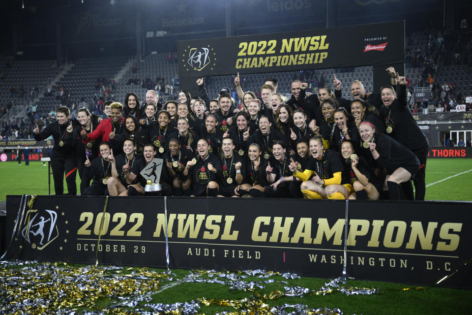 Portland Thorns FC pose with the trophy after they won the NWSL championship soccer match against the Kansas City Current, Saturday, Oct. 29, 2022, in Washington. Portland won 2-0. (AP Photo/Nick Wass)
