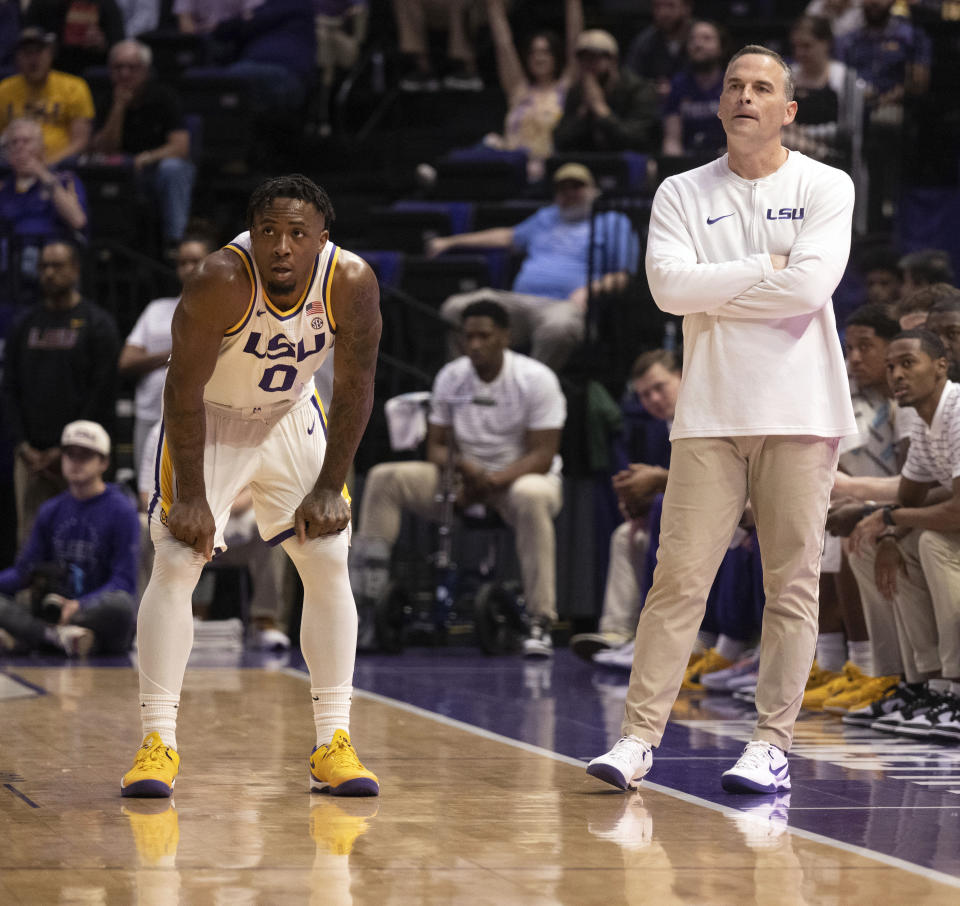 LSU guard Trae Hannibal (0) chats with coach Matt McMahon during the team's NCAA college basketball game against Georgia on Tuesday, Feb. 27, 2024, in Baton Rouge, La. (Hilary Scheinuk/The Advocate via AP)